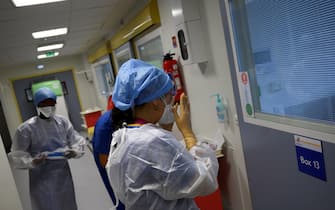 A Nurse gets ready  to enter a room where a patient suffering from covid 19 is hospitalized at the emergency unit of La Timone hospital in Marseille, southeastern France, on September 11, 2020. (Photo by Christophe SIMON / AFP) (Photo by CHRISTOPHE SIMON/AFP via Getty Images)