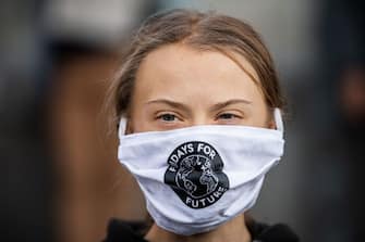 Swedish climate activist Greta Thunberg (C) takes part in a Fridays For Future protest in front of the Swedish Parliament (Riksdagen) in Stockholm on September 25, 2020. - Fridays for Future school strike movement called for a global day of climate action on September 25, 2020. (Photo by JONATHAN NACKSTRAND / AFP) (Photo by JONATHAN NACKSTRAND/AFP via Getty Images)