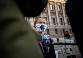 Swedish climate activist Greta Thunberg is interviewed during a Fridays For Future protest in front of the Swedish Parliament (Riksdagen) in Stockholm on September 25, 2020. - Fridays for Future school strike movement called for a global day of climate action on September 25, 2020. (Photo by JONATHAN NACKSTRAND / AFP) (Photo by JONATHAN NACKSTRAND/AFP via Getty Images)