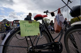LEIDEN, NETHERLANDS. SEPTEMBER 25: Several demonstrators carry banners against climate change on their bikes during the global day of climate action on September 25, 2020 in Leiden, Netherlands. Members of the organization Fridays for Future have marched with their bikes in several Dutch cities, as a protest against the lack of policies to mitigate climate change, during the global day of climate action