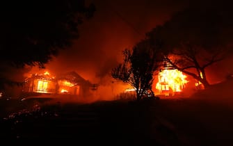 ST. HELENA, CALIFORNIA - SEPTEMBER 27: The Glass Mountain Inn burns as the Glass Fire moves through the area on September 27, 2020 in St. Helena, California. The fast moving Glass fire has burned over 1,000 acres and has destroyed homes. Much of Northern California is under a red flag warning for high fire danger through Monday evening. (Photo by Justin Sullivan/Getty Images)