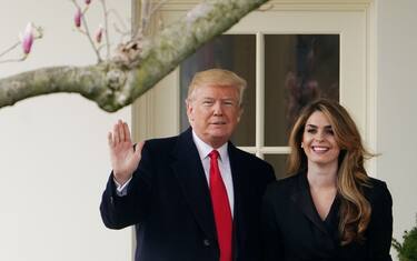 US President Donald Trump poses with former communications director Hope Hicks shortly before making his way to board Marine One on the South Lawn and departing from the White House on March 29, 2018. 
Trump is visiting Ohio to speak on infrastructure development before heading to Palm Beach, Florida.  / AFP PHOTO / Mandel NGAN        (Photo credit should read MANDEL NGAN/AFP via Getty Images)
