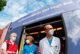 Medical staff wait for the opening of the mobile flu vaccination station "Impfbim" located in a tram in Vienna, Austria, on October 1, 2020. - The city is encouraging residents to get the vaccine in order to reduce any coronavirus-related pressure on the health system over the winter. (Photo by JOE KLAMAR / AFP) (Photo by JOE KLAMAR/AFP via Getty Images)