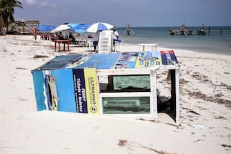 1279219243 CANCUN, MEXICO - OCTOBER 8: Wrecked ferry ticket booth lies destroyed by Hurricane Delta in 'Playa Tortuga' on October 8, 2020 in Cancun, Mexico. Hurricane Delta made landfall in the Mexican east coast in the morning of Wednesday October 07, between Cancún and Playa del Carmen, forcing evacuations in touristic areas. Governors of regions of Quintana Roo and Yucatán reported no deaths or major damage to the infrastructure. The powerful category 2 storm is expected to increase its power as it approaches the US Gulf coast. American National Hurricane Center informed Delta will move inland by late Friday 09. (Photo by Harold Alcocer/MediosyMedia/Getty Images)