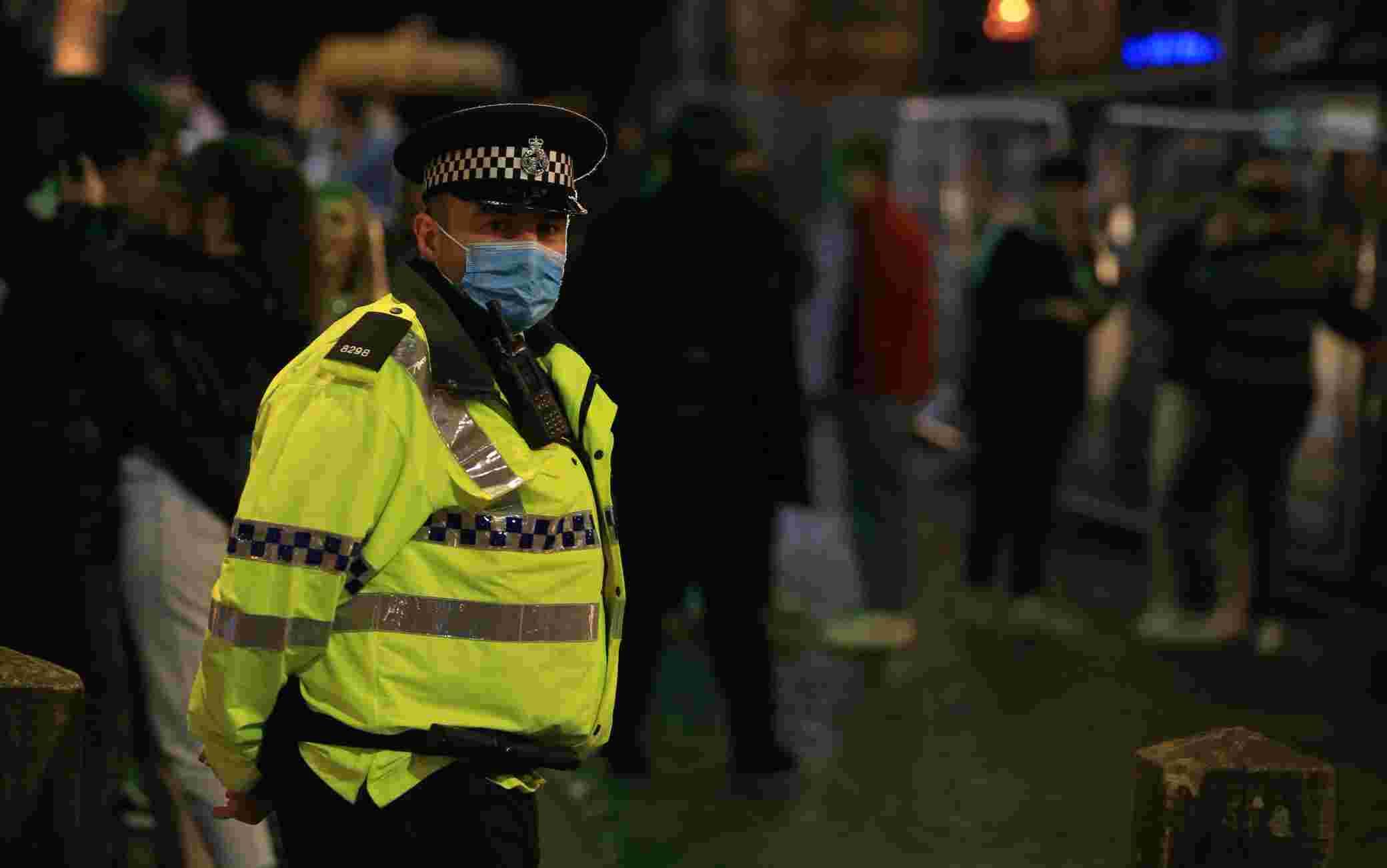 Police patrol as revellers enjoy a night out in the centre of Liverpool, north west England on October 10, 2020 ahead of new measures set to be introduced in the northwest next week to help stem the spread of the novel coronavirus. - Prime Minister Boris Johnson is expected to outline the new regime on Monday as rates of Covid 19 infection surge particularly in the north, worsening a national death toll of more than 42,000 which is already the worst in Europe. (Photo by Lindsey Parnaby / AFP) (Photo by LINDSEY PARNABY/AFP via Getty Images)