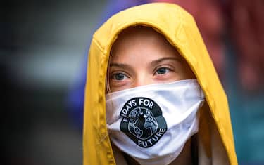 Swedish climate activist Greta Thunberg is pictured during a "Fridays for Future" protest in front of the Swedish Parliament Riksdagen in Stockholm on October 9, 2020. (Photo by Jonathan NACKSTRAND / AFP) (Photo by JONATHAN NACKSTRAND/AFP via Getty Images)