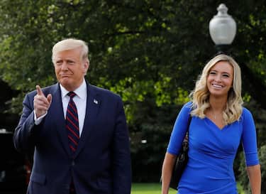 epa08722418 (FILE) - US President Donald J. Trump walks with White House Press Secretary Kayleigh McEnany towards reporters on the South Lawn before his departure to Philadelphia, at the White House in Washington, DC, USA, 15 September 2020 (reissued 05 October 2020). McEnany reported on 05 October that she has tested positive for the SARS-CoV-2 coronavirus. US President Donald J. Trump tested positive for the SARS-CoV-2 on 02 October and was transferred to Walter Reed National Military Medical Center on 03 October to receive medical attention.  EPA/Yuri Gripas / POOL