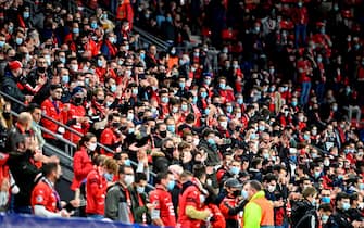1229186577 Supporters wearing face masks stand pior to the UEFA Europa League Group E first-leg football match between Stade Rennais FC and FK Krasnodar at the Roazhon Park stadium in Rennes, northwestern France, on October 20, 2020. (Photo by DAMIEN MEYER / AFP) (Photo by DAMIEN MEYER/AFP via Getty Images)