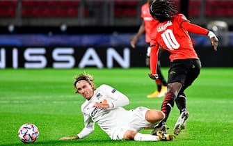 1229188575 FK Krasnodar's Swedish midfielder Kristoffer Olsson (L) fights for the ball with Rennes' French midfielder Eduardo Camavinga during the UEFA Europa League Group E first-leg football match between Stade Rennais FC and FK Krasnodar at the Roazhon Park stadium in Rennes, northwestern France, on October 20, 2020. (Photo by DAMIEN MEYER / AFP) (Photo by DAMIEN MEYER/AFP via Getty Images)