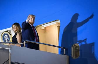 US President Donald Trump and First Lady Melania Trump board Air Force One before departing from Nashville International Airport in Nashville, Tennessee on October 22, 2020, after the final presidential debate. (Photo by MANDEL NGAN / AFP) (Photo by MANDEL NGAN/AFP via Getty Images)