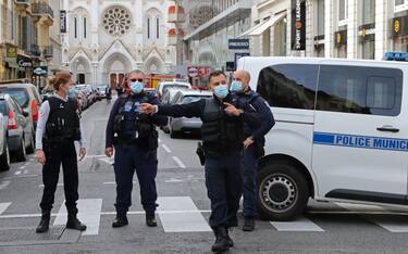 French policemen stand guard the street leading to the Basilica of Notre-Dame de Nice after a knife attack in Nice on October 29, 2020. - France's national anti-terror prosecutors said Thursday they have opened a murder inquiry after a man killed three people at a basilica in central Nice and wounded several others. The city's mayor, Christian Estrosi, told journalists at the scene that the assailant, detained shortly afterwards by police, "kept repeating 'Allahu Akbar' (God is Greater) even while under medication." He added that President Emmanuel Macron would be arriving shortly in Nice. (Photo by Valery HACHE / AFP) (Photo by VALERY HACHE/AFP via Getty Images)