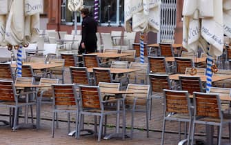 epa08785123 Locked chairs stand in front of a restaurant in Speyer, Germany, 30 October 2020. Nationwide restrictions to counter a surge in infections, such as the closure of bars and restaurants for one month starting 02 November, have been announced on 28 October due to an increasing number of cases of the pandemic COVID-19 disease caused by the coronavirus SARS CoV-2.  EPA/RONALD WITTEK