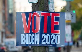 epaselect epa08797113 A sign supporting Joe Biden hangs in Philadelphia, Pennsylvania, USA, 03 November 2020. Americans vote on Election Day to choose between re-electing Donald J. Trump or electing Joe Biden as the 46th President of the United States to serve from 2021 through 2024.  EPA/TRACIE VAN AUKEN