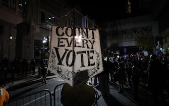 epa08802029 People rally to demand that every vote be counted outside of the Pennsylvania Convention Center in Philadelphia, Pennsylvania, USA, 05 November 2020. Counting of mail-in ballots in Pennsylvania began on 03 November and is expected to stretch to 06 November.  EPA/JUSTIN LANE