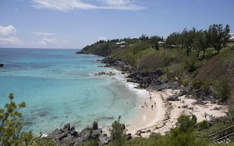 epa06311388 (FILE) - Sunbathers relax on the beach and the waters of Church Bay Park in Southampton, Bermuda, 14 June 2017 (reissued 06 November 2017). Media reports on 05 November 2017 state that a leak of financial documents dubbed the Paradise Papers with 13.4 million documents has revealed how powerful and ultra-wealthy people secretly invest vast amounts of cash in offshore tax havens. The vast majority of the transactions involve no legal wrongdoing. According to the reports, the leaked documents allegedly originate from the Bermuda-based lawfirm Appleby and were obtained by German newspaper Sueddeutsche Zeitung and shared among the ICIJ, the International Consortium of Investigative Journalists.  EPA/CJ GUNTHER