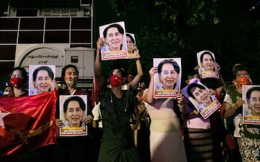 Supporters of the National League for Democracy (NLD) party hold portraits of Aung San Suu Kyi as they celebrate in front of the party's headquarters in Yangon on November 9, 2020, as NLD officials said they were confident of a landslide victory in the weekend's election. - Aung San Suu Kyi's ruling National League for Democracy said on November 9, 2020, it was confident of winning a landslide victory in Myanmar as official results trickled in following the weekend's coronavirus-disrupted election. Millions had lined up for hours to cast their ballots on November 8, 2020 -- only the second national election since the country emerged from outright military rule in 2011. (Photo by Sai Aung Main / AFP) (Photo by SAI AUNG MAIN/AFP via Getty Images)