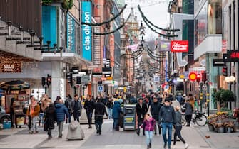 People stroll at the Drottninggatan shopping street in central Stockholm on November 10, 2020, amid the novel coronavirus COVID-19 pandemic. (Photo by Fredrik SANDBERG / TT News Agency / AFP) / Sweden OUT (Photo by FREDRIK SANDBERG/TT News Agency/AFP via Getty Images)