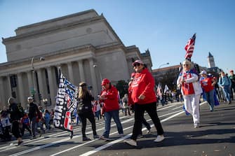 epa08820672 Supporters of US President Donald J. Trump march to the Supreme Court in Washington, DC, USA, 14 November 2020. US President Donald J. Trump has refused to concede the 2020 Presidential election to his Democratic challenger President Elect Joe Biden.  EPA/SHAWN THEW