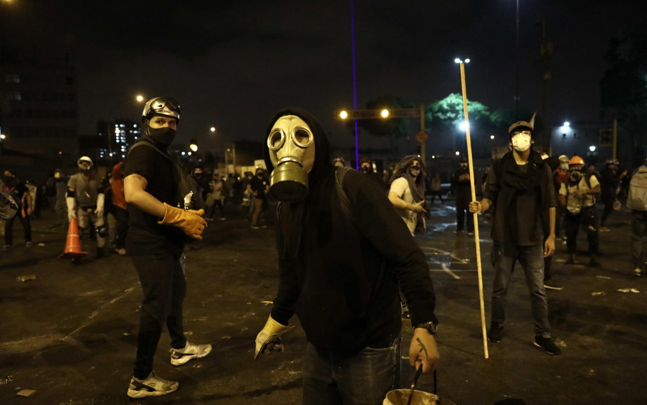 PERU PROTESTS epa08821086 Police and demonstrators clash during a protest against the new government of President Manuel Merino, in San Martin de Lima square, in Lima, Peru, 14 November 2020. Merino took office on 10 November amid a controversial constitutional process after the dismissal of former President Martin Vizcarra for 'moral incapacity' by Peruvian Congress. EPA/Aldair Mejia