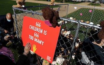 WASHINGTON, DC - NOVEMBER 16: Volunteers from pro-immigration group Families Belong Together build and fill a chainlink cage with about 600 teddy bears 'representing the children still separated as a result of U.S. immigration policies' on the National Mall November 16, 2020 in Washington, DC. Organized by the National Domestic Workers Alliance, Families Belong Together was formed in 2018 in response to the Trump Administration's policy of separating children from their parents after they enter the U.S. to seek refuge, resulting in hundreds of children unable to be reunited with their families because of poor administration and tracking. (Photo by Chip Somodevilla/Getty Images)