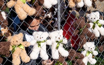 Volunteers and staff with Families Belong Together and the Franciscan Action Network (FAN), install more than 600 teddy bears in a chain-link cage to represent children separated from their families by US immigration policies, during a protest exhibit near the US Capitol in Washington, DC, November 16, 2020. (Photo by SAUL LOEB / AFP) (Photo by SAUL LOEB/AFP via Getty Images)