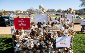 Volunteers and staff with Families Belong Together and the Franciscan Action Network (FAN), install more than 600 teddy bears in a chain-link cage to represent children separated from their families by US immigration policies, during a protest exhibit near the US Capitol in Washington, DC, November 16, 2020. (Photo by SAUL LOEB / AFP) (Photo by SAUL LOEB/AFP via Getty Images)