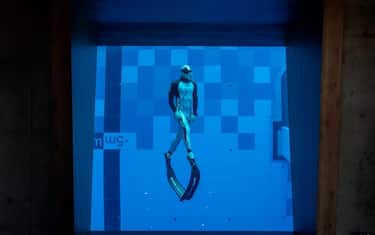 A diver is seen in the deepest pool in the world with 45.5-metre (150-foot) located in Mszczonow about 50 km from Warsaw, November 21, 2020. - The complex, named Deepspot, even includes a small wreck for scuba and free divers to explore. It has 8,000 cubic metres of water -- more than 20 times the amount in an ordinary 25-metre pool. (Photo by Wojtek RADWANSKI / AFP) (Photo by WOJTEK RADWANSKI/AFP via Getty Images)