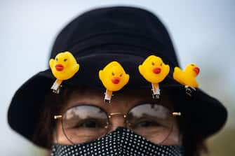 BANGKOK, THAILAND - NOVEMBER 22: Rubber duck hair clips are seen decorating the hat wore by an anti-government protester on November 22, 2020 in Bangkok, Thailand. Students and "red shirt" demonstrators held a carnival-themed pro-democracy protest on Sunday, as part of a series of protests that have taken place demanding constitutional reforms. (Photo by Sirachai Arunrugstichai/Getty Images)