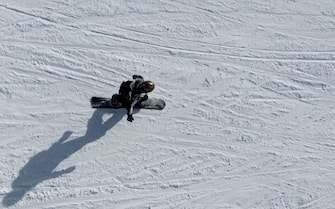 ISCHGL, AUSTRIA - NOVEMBER 27:  A man rides a snowboard during the winter season opening on November 27, 2010 in Ischgl, Austria. Ischgl has more then 230 kilometers of ski slopes and is one of Austria's biggest mountain resorts.  (Photo by Miguel Villagran/Getty Images)