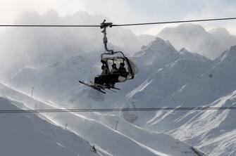 ISCHGL, AUSTRIA - NOVEMBER 27:  Skiers sit inside a gondola during the winter season opening on November 27, 2010 in Ischgl, Austria. Ischgl has more then 230 kilometers of ski slopes and is one of Austria's biggest mountain resorts.  (Photo by Miguel Villagran/Getty Images)