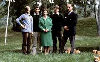 1175337493 Picture of Queen Elizabeth and Duke of Edinburgh (R) posing with theirs three sons, Charles, Edward (L), Andrew (2ndR) and the royal corgies for their 32nd wedding anniversary, in Balmoral Castle, Scotland, 20 November 1979. (Photo by - / AFP) (Photo by -/AFP via Getty Images)