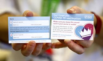 epa08868468 A card that will be given to patients following a vaccination for COVID-19  at Croydon University Hospital in southern London, Britain, 05 December 2020 (issued 07 December 2020). Britain has pre-ordered 40 million doses of the Pfizer-BioNTec and is expecting to start the rollout from tomorrow.  EPA/Gareth Fuller / PA POOL