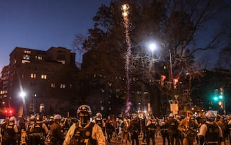 WASHINGTON, DC - DECEMBER 12:  Police separate Trump supporters and members of Antifa while a firecracker is set off during a protest on December 12, 2020 in Washington, DC. Thousands of protesters who refuse to accept that President-elect Joe Biden won the election are rallying ahead of the electoral college vote to make Trump's 306-to-232 loss official.  (Photo by Stephanie Keith/Getty Images)