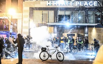 WASHINGTON, DC - DECEMBER 12: An explosion goes off in front of a hotel where the Proud Boys are staying during a protest on December 12, 2020 in Washington, DC. Thousands of protesters who refuse to accept that President-elect Joe Biden won the election are rallying ahead of the electoral college vote to make Trump's 306-to-232 loss official.  (Photo by Stephanie Keith/Getty Images)