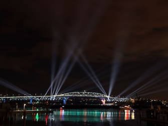 AUCKLAND, NEW ZEALAND - JANUARY 01: Auckland Harbour Bridge light show during Auckland New Year's Eve celebrations on January 01, 2021 in Auckland, New Zealand. (Photo by Fiona Goodall/Getty Images for Auckland Unlimited)