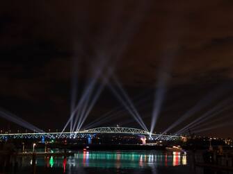 AUCKLAND, NEW ZEALAND - JANUARY 01: Auckland Harbour Bridge light show during Auckland New Year's Eve celebrations on January 01, 2021 in Auckland, New Zealand. (Photo by Fiona Goodall/Getty Images for Auckland Unlimited)