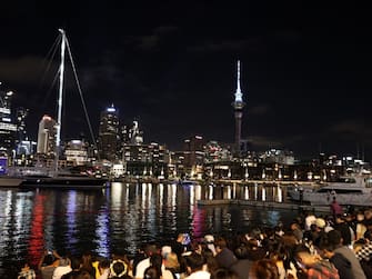 AUCKLAND, NEW ZEALAND - JANUARY 01: Crowds wait for the fireworks during Auckland New Year's Eve celebrations on January 01, 2021 in Auckland, New Zealand. (Photo by Fiona Goodall/Getty Images for Auckland Unlimited)