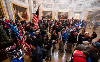 epaselect epa08923423 Supporters of US President Donald J. Trump in the Capitol Rotunda after breaching Capitol security in Washington, DC, USA, 06 January 2021. Protesters entered the US Capitol where the Electoral College vote certification for President-elect Joe Biden took place.  EPA/JIM LO SCALZO