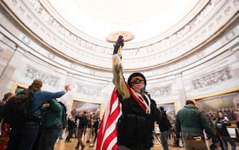 epa08923421 Supporters of US President Donald J. Trump in the Capitol Rotunda after breaching Capitol security in Washington, DC, USA, 06 January 2021. Protesters entered the US Capitol where the Electoral College vote certification for President-elect Joe Biden took place.  EPA/JIM LO SCALZO