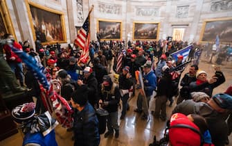 epa08923423 Supporters of US President Donald J. Trump in the Capitol Rotunda after breaching Capitol security in Washington, DC, USA, 06 January 2021. Protesters entered the US Capitol where the Electoral College vote certification for President-elect Joe Biden took place.  EPA/JIM LO SCALZO