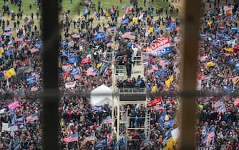 epa08923268 Supporters of US President Donald J. Trump and his baseless claims of voter fraud breach Capitol security and climb the inauguration stand to protest Congress certifying Joe Biden as the next president in Washington, DC, USA, 06 January, 2020.  EPA/JIM LO SCALZO