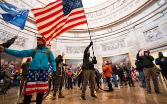 epa08923424 Supporters of US President Donald J. Trump in the Capitol Rotunda after breaching Capitol security in Washington, DC, USA, 06 January 2021. Protesters entered the US Capitol where the Electoral College vote certification for President-elect Joe Biden took place.  EPA/JIM LO SCALZO