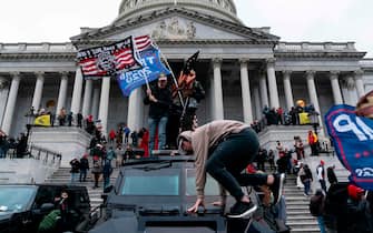 Supporters of US President Donald Trump protest outside the US Capitol on January 6, 2021, in Washington, DC.  - Demonstrators breeched security and entered the Capitol as Congress debated the a 2020 presidential election Electoral Vote Certification.  (Photo by ALEX EDELMAN / AFP)