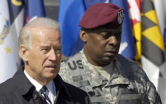 epa08869606 (FILE) - Then US Vice President Joe Biden (L) and US Lt. General Lloyd J. Austin III enter a ceremony welcoming troops home at Fort Bragg outside Fayetteville, North Carolina 08 April 2009 (reissued 08 December 2020). According to media reports on 08 December, US President-elect Joe Biden picked retired General Lloyd James Austin III to be his Defense Secretary. If confirmed by the Senate, Austin will be the first African American to hold the position.  EPA/STAN GILLILAND