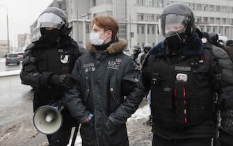 epa08976821 Russian police officers detain protester during an unauthorized protest in support of Russian opposition leader Alexei Navalny, Moscow, Russia, 31 January 2021. Navalny was detained after his arrival to Moscow from Germany, where he was recovering from a poisoning attack with a nerve agent, on 17 January 2021. A Moscow judge on 18 January ruled that he will remain in custody for 30 days following his airport arrest. Navalny urged Russians to take to the streets to protest. In many Russian cities mass events are prohibited due to an increase in COVID-19 cases.  EPA/YURI KOCHETKOV