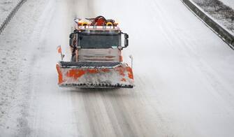 GERMANY WEATHER SNOW STORM epa08993487 A snowplow drives on the snow-covered motorway A40 in Dortmund, Germany, 07 February 2021. A heavy winter storm with cold easterly winds brings ice and fresh fallen snow with snow drifts. Many railway services in the West are disrupted. EPA/FRIEDEMANN VOGEL