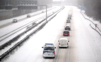 GERMANY WEATHER SNOW STORM epa08994098 Cars drive on the snow covered motorway A2 in Kamen, Germany, 07 February 2021. A heavy winter storm with cold easterly winds brings ice and fresh fallen snow with snow drifts. Many railway services in the West are disrupted. EPA/FRIEDEMANN VOGEL