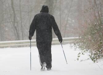 GERMANY WEATHER SNOW STORM epa08993381 A man walks in the snow near Wildeshausen, northern Germany, 07 February 2021. A heavy winter storm with cold easterly winds brings ice and fresh fallen snow with snow drifts. Many railway services in the North are disrupted. EPA/FOCKE STRANGMANN