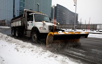 Feb 15, 2021; Cincinnati, OH, USA; A snow blow clears snow in off of Vine Street in Downtown Cincinnati on Monday, Feb. 15, 2021. The National Weather Service issued a winter storm warning starting Monday and going through 1 p.m. Tuesday. Heavy is snow expected, with total snow accumulations of 8-12 inches in Cincinnati, according to the National Weather Service.  Mandatory Credit: Albert Cesare-USA TODAY NETWORK/Sipa USA