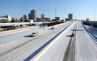 NO FILM, NO VIDEO, NO TV, NO DOCUMENTARY - Vehicles drive on a snowy Interstate 30 on Monday, February 15, 2021, in Fort Worth, TX, USA. North Texas experienced record breaking low temperatures and the entire state of Texas was under a winter warning advisory. Photo by Amanda McCoy/Fort Worth Star-Telegram/TNS/ABACAPRESS.COM